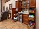 Well-stocked wet bar with cabinets, drawers, and a beverage cooler at 10724 S Mustang Dr, Goodyear, AZ 85338