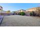 Large grassy backyard with fire pit at 1132 W Santa Gertrudis Trl, San Tan Valley, AZ 85143