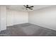 Large bedroom with ceiling fan and carpet at 1132 W Santa Gertrudis Trl, San Tan Valley, AZ 85143