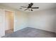 Bedroom with ceiling fan, gray carpet and access to closet at 1132 W Santa Gertrudis Trl, San Tan Valley, AZ 85143