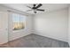 Bright bedroom with ceiling fan and carpeted floors at 1132 W Santa Gertrudis Trl, San Tan Valley, AZ 85143