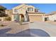 Two-story house with a large driveway and landscaping at 1132 W Santa Gertrudis Trl, San Tan Valley, AZ 85143