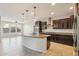 Spacious kitchen with dark wood cabinets and granite countertops at 1132 W Santa Gertrudis Trl, San Tan Valley, AZ 85143