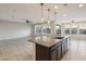 Spacious kitchen with dark wood cabinets and granite countertops at 1132 W Santa Gertrudis Trl, San Tan Valley, AZ 85143