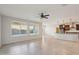 Bright living room with tile floors and large windows at 1132 W Santa Gertrudis Trl, San Tan Valley, AZ 85143