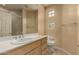 Clean bathroom with updated vanity and block glass windows at 11664 E Caron St, Scottsdale, AZ 85259