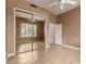 Bedroom with mirrored closet and ceiling fan at 11664 E Caron St, Scottsdale, AZ 85259