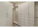 Large walk-in closet with ample shelving and drawer space at 11664 E Caron St, Scottsdale, AZ 85259