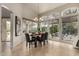 Sunlit dining area with a table for six and sliding glass doors to patio at 11664 E Caron St, Scottsdale, AZ 85259