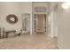 Bright and spacious entryway with tile flooring and a wooden door at 11664 E Caron St, Scottsdale, AZ 85259