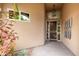 Covered entryway with security door and decorative wall art at 11664 E Caron St, Scottsdale, AZ 85259