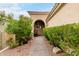 Pathway to front door with mature landscaping and stone accents at 11664 E Caron St, Scottsdale, AZ 85259