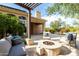 Relaxing patio with fire pit and comfortable seating area at 11664 E Caron St, Scottsdale, AZ 85259