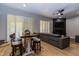 Farmhouse dining table with four chairs near living room at 11683 N 135Th Pl, Scottsdale, AZ 85259