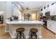 Modern kitchen with white cabinets and large island at 11683 N 135Th Pl, Scottsdale, AZ 85259