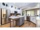 Spacious kitchen featuring an island, stainless steel appliances, and hardwood floors at 11683 N 135Th Pl, Scottsdale, AZ 85259