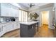 Modern kitchen with island, stainless steel appliances, and white cabinets at 11683 N 135Th Pl, Scottsdale, AZ 85259