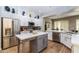 Modern kitchen with white cabinets, island, and stainless appliances at 11683 N 135Th Pl, Scottsdale, AZ 85259