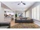 Open living area with gray sectional sofa and kitchen views at 11683 N 135Th Pl, Scottsdale, AZ 85259