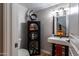 Modern powder room with black shelving and white sink at 11683 N 135Th Pl, Scottsdale, AZ 85259