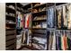 Large walk-in closet with ample shelving and hanging space at 11683 N 135Th Pl, Scottsdale, AZ 85259