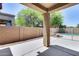 Covered patio overlooks a refreshing pool and grassy backyard at 11820 W Monte Lindo Ln, Sun City, AZ 85373