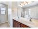 Bathroom with double vanity and large mirror at 11820 W Monte Lindo Ln, Sun City, AZ 85373