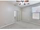 Bedroom with mirrored closet and ceiling fan at 11820 W Monte Lindo Ln, Sun City, AZ 85373