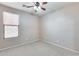 Spacious bedroom with ceiling fan and neutral wall colors at 11820 W Monte Lindo Ln, Sun City, AZ 85373