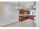 Kitchen with dark wood cabinets, granite counters, and stainless steel appliances at 11820 W Monte Lindo Ln, Sun City, AZ 85373