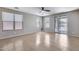 Bright living room with tile flooring and sliding glass doors to backyard at 11820 W Monte Lindo Ln, Sun City, AZ 85373