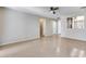 Living room with tile floor and views to kitchen at 11820 W Monte Lindo Ln, Sun City, AZ 85373