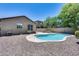 Charming kidney-shaped pool in a gravel backyard at 11820 W Monte Lindo Ln, Sun City, AZ 85373