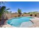 Relaxing kidney-shaped pool with surrounding patio at 11820 W Monte Lindo Ln, Sun City, AZ 85373