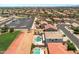 Aerial view of a house with pool, and surrounding neighborhood at 11860 W Grant St, Avondale, AZ 85323