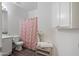 Bathroom with floral shower curtain and white vanity at 11860 W Grant St, Avondale, AZ 85323