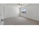 Bright bedroom featuring a ceiling fan and carpet at 11860 W Grant St, Avondale, AZ 85323