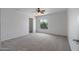 Well-lit bedroom with ceiling fan and window at 11860 W Grant St, Avondale, AZ 85323