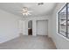 Spacious bedroom with ceiling fan and en-suite bathroom at 11860 W Grant St, Avondale, AZ 85323