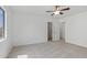 Spacious bedroom with ceiling fan and carpet at 11860 W Grant St, Avondale, AZ 85323