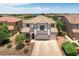 Two-story house with a three-car garage and landscaped yard at 11860 W Grant St, Avondale, AZ 85323