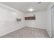 Bright laundry room with built-in cabinets and shelving at 11860 W Grant St, Avondale, AZ 85323