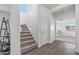 Carpeted staircase with wood flooring and adjacent bedroom at 11860 W Grant St, Avondale, AZ 85323