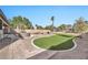 Backyard oasis with a hot tub and putting green at 11930 W Monroe St, Avondale, AZ 85323