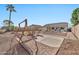 Spacious backyard with a patio, putting green, and fire pit at 11930 W Monroe St, Avondale, AZ 85323