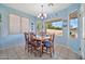 Bright dining area with table and chairs, featuring a view of the backyard at 11930 W Monroe St, Avondale, AZ 85323