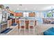 View of kitchen island and stainless steel appliances from the living room at 11930 W Monroe St, Avondale, AZ 85323