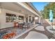 Covered patio with seating area and ceiling fan at 11930 W Monroe St, Avondale, AZ 85323