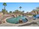 Inviting pool with waterfall feature and spacious patio at 11930 W Monroe St, Avondale, AZ 85323