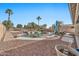 Relaxing backyard oasis featuring a kidney shaped pool at 11930 W Monroe St, Avondale, AZ 85323